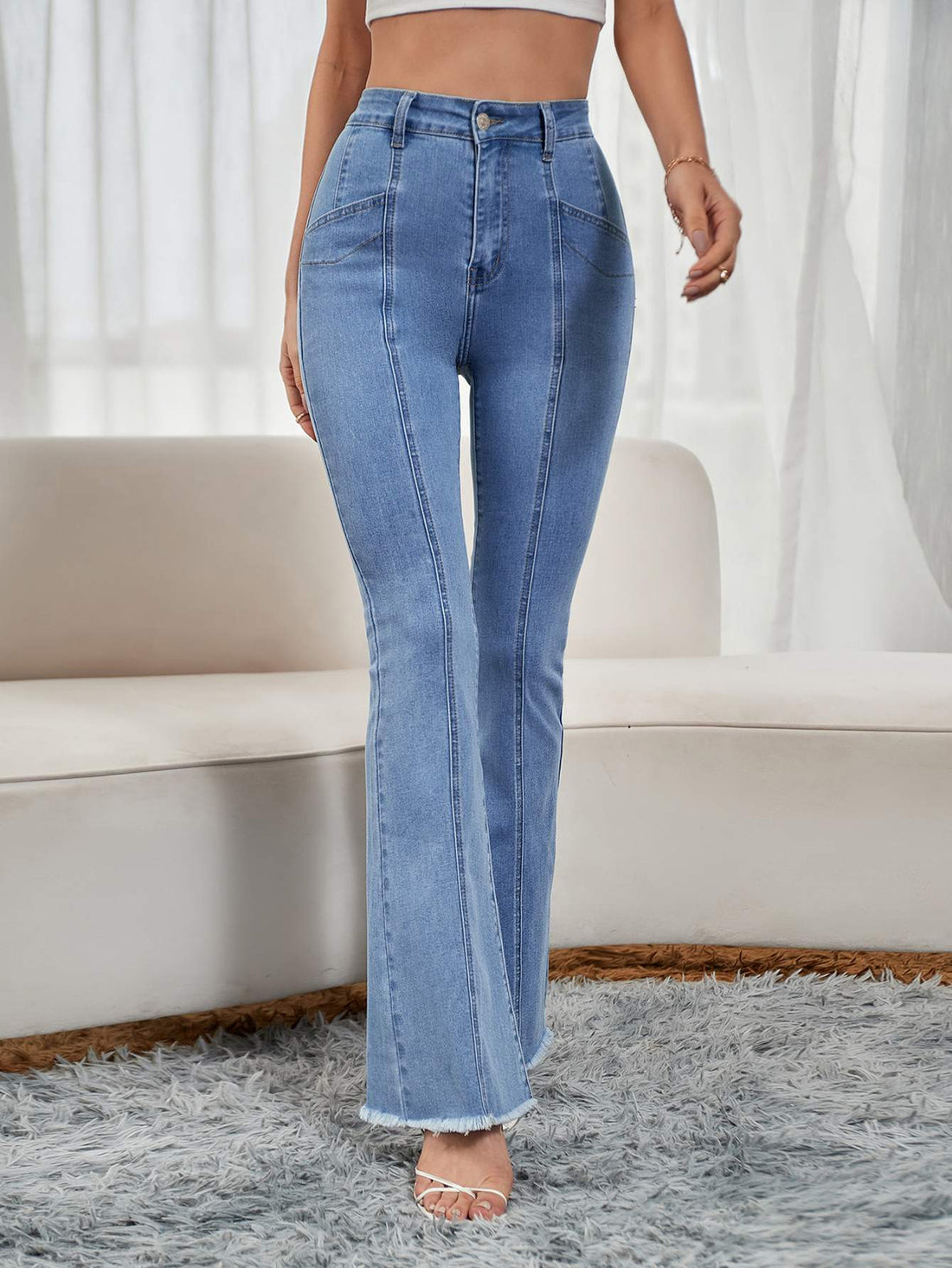 RAW HEM PANELED FLARE LEG JEANS