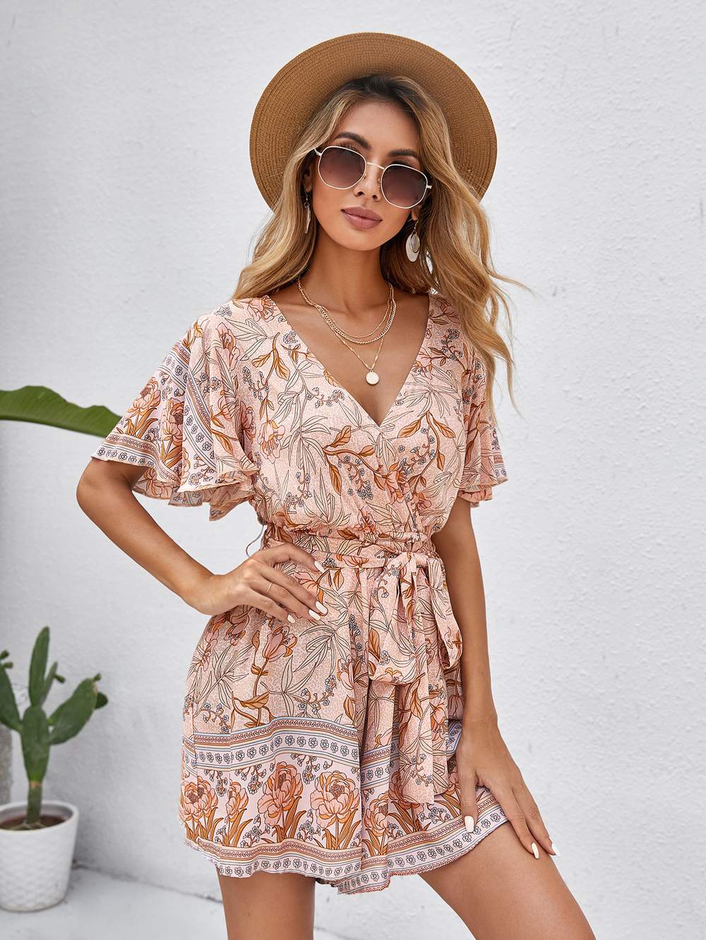 SURPLICE FRONT ALLOVER FLORAL BELTED ROMPER